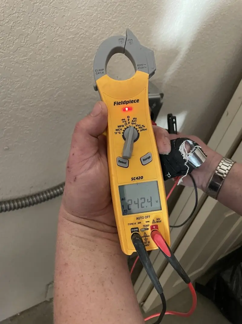 Voltage testing with clamp meter during Generator Installation in Fortuna Foothills